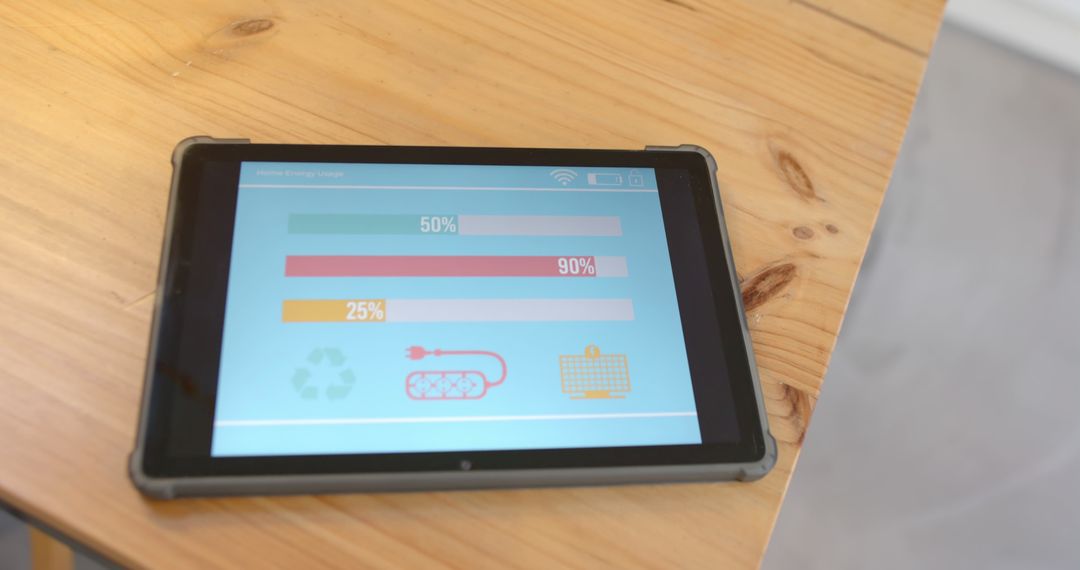 Tablet on Wooden Desk Displaying Energy Usage Tracking Graphs - Free Images, Stock Photos and Pictures on Pikwizard.com