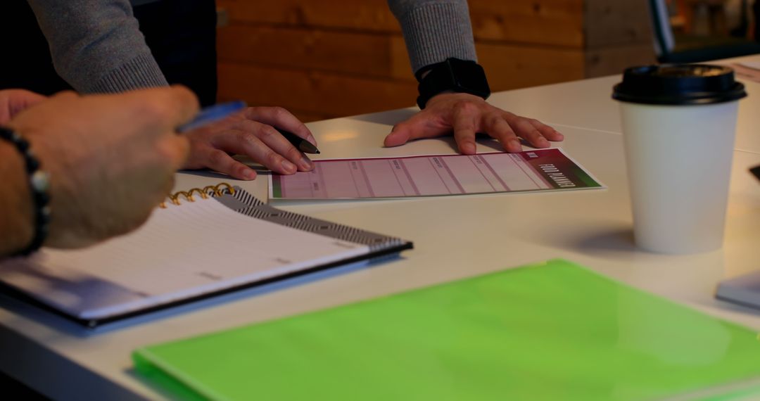 Business Team Collaborating Over Documents in Modern Office