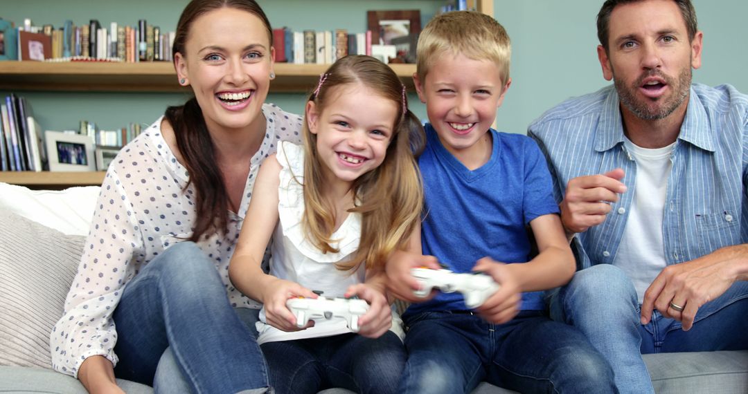 Happy Family Playing Video Games Together on Couch - Free Images, Stock Photos and Pictures on Pikwizard.com