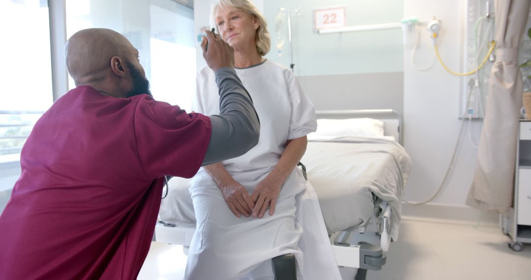 Healthcare Professional Checking Senior Patient in Hospital Room - Free Images, Stock Photos and Pictures on Pikwizard.com