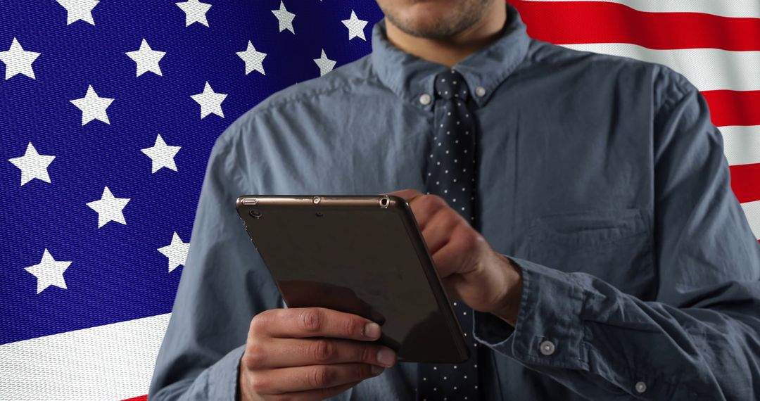 Caucasian Businessman Using Tablet in Front of USA Flag