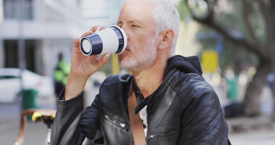 Senior Man Drinking Coffee Outdoors In Urban Setting - Free Images, Stock Photos and Pictures on Pikwizard.com