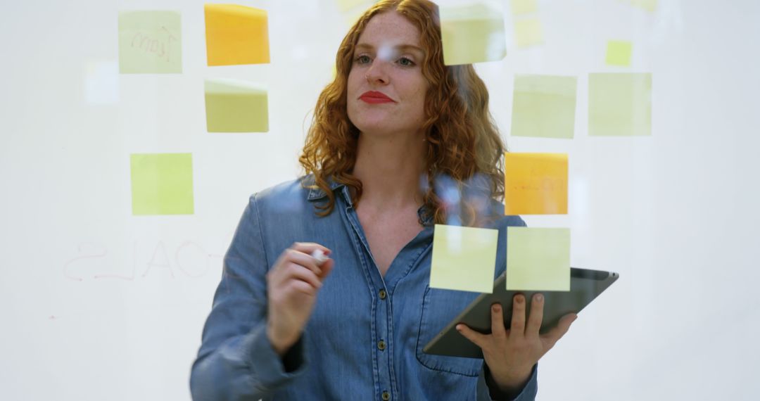 Confident Businesswoman Brainstorming with Sticky Notes - Free Images, Stock Photos and Pictures on Pikwizard.com