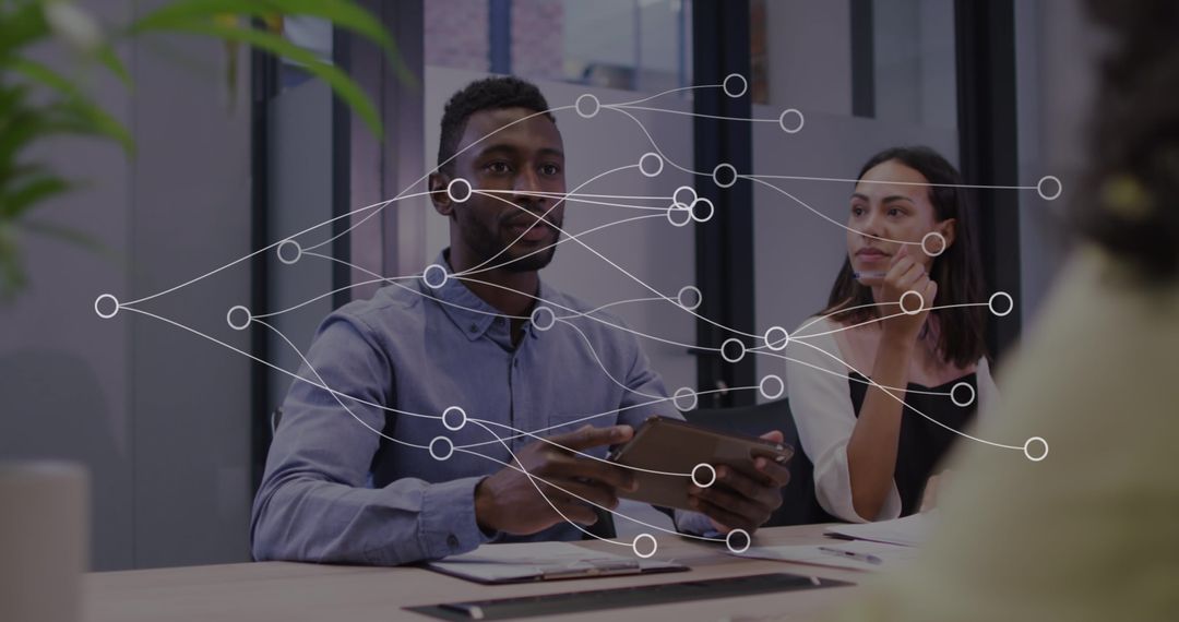 Diverse Team Engaging with Digital Network Visualization