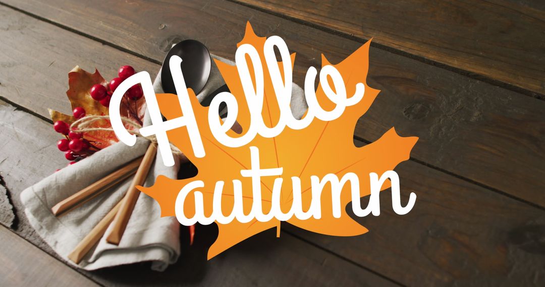 Hello Autumn Greeting with Leaves and Cutlery on Wooden Surface