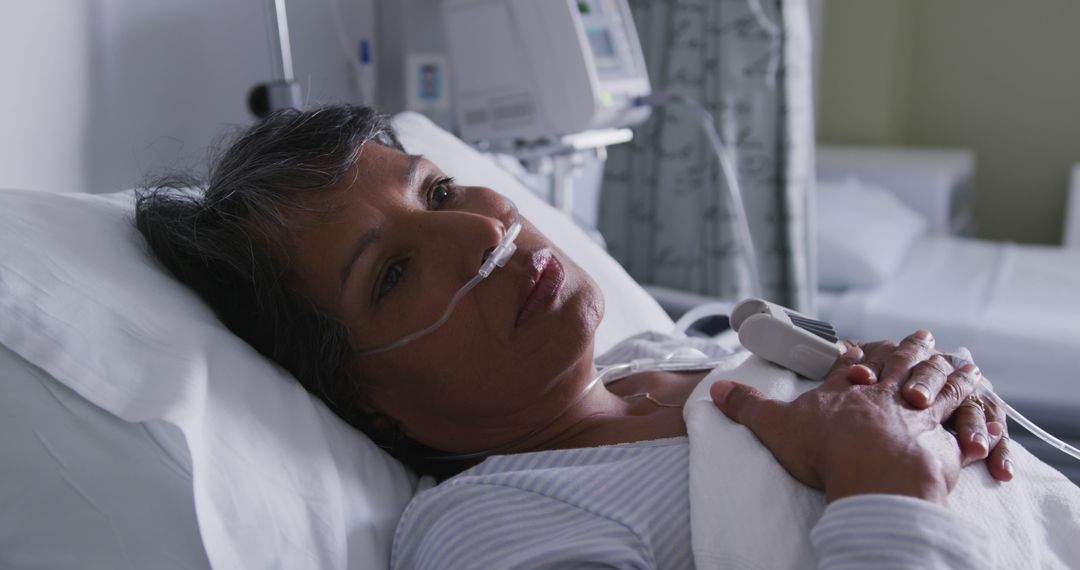 Elderly Woman Resting in Hospital Bed with Oxygen Tube - Free Images, Stock Photos and Pictures on Pikwizard.com