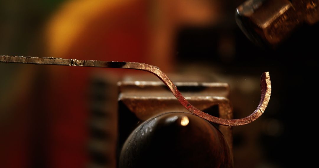 Blacksmith Crafting Iron Rod with Hammer in Workshop