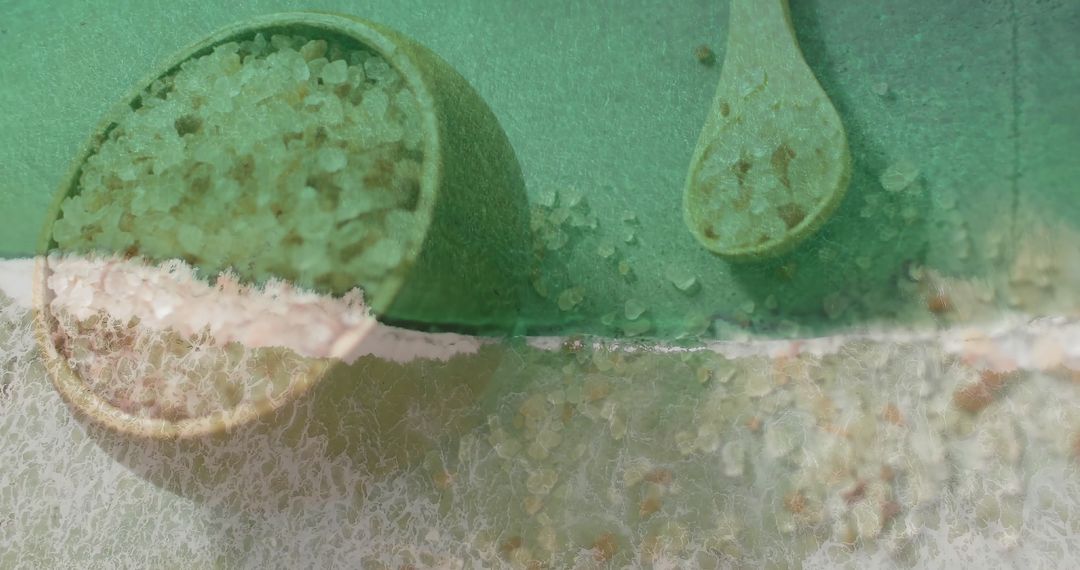 Coarse Salt with Green Bowl and Wooden Spoon Overlaid with Ocean Wave