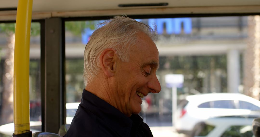 Senior Man Smiling While Traveling on Public Transport - Free Images, Stock Photos and Pictures on Pikwizard.com