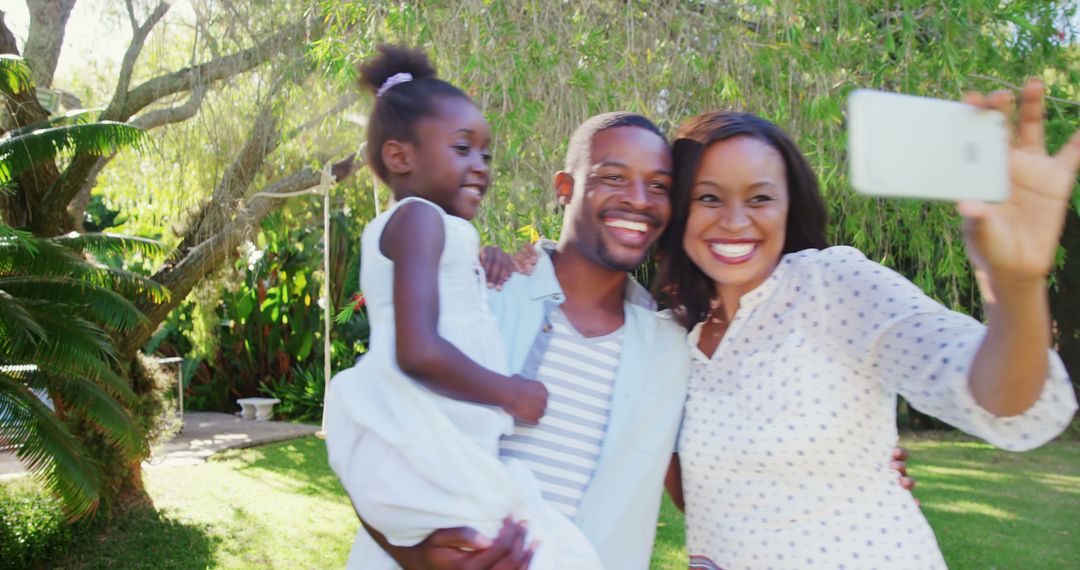 Happy African American Family Taking Selfie Outdoors in Garden - Free Images, Stock Photos and Pictures on Pikwizard.com