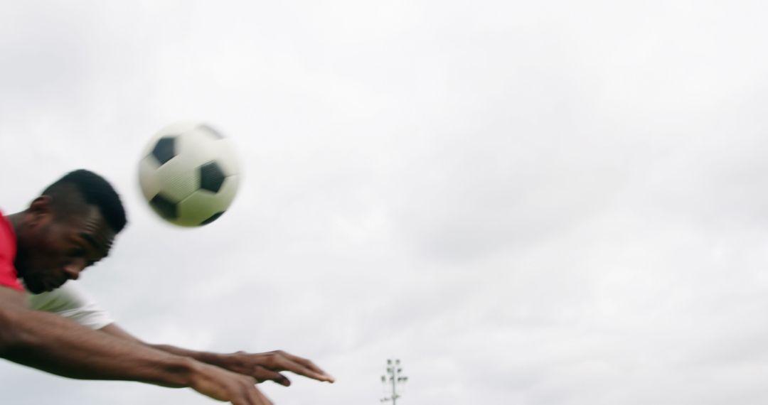 Soccer Player Heading Ball During Intense Match - Free Images, Stock Photos and Pictures on Pikwizard.com