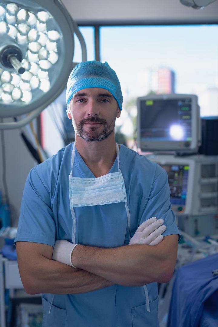 Male Surgeon Standing in Operating Room - Free Images, Stock Photos and Pictures on Pikwizard.com