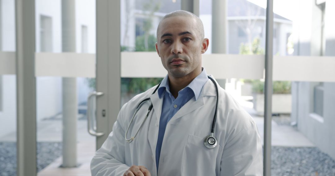 Confident Male Medical Professional in Hospital Lobby - Free Images, Stock Photos and Pictures on Pikwizard.com