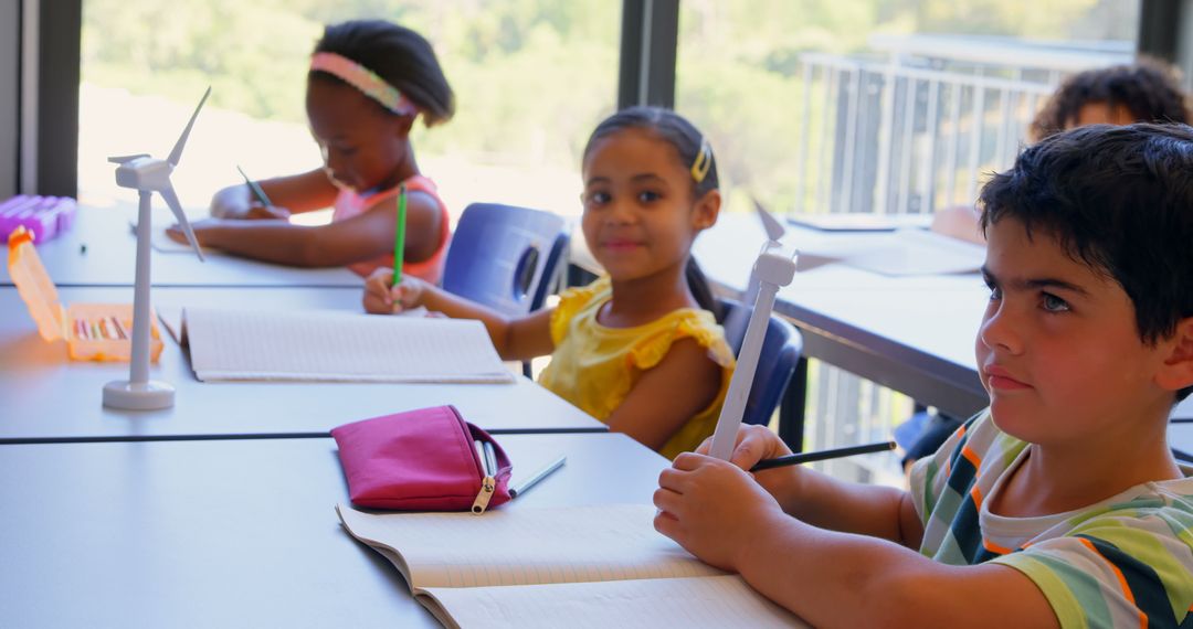 Diverse Students Learning Renewable Energy with Wind Turbines Model