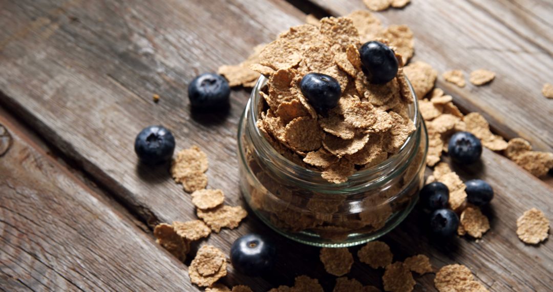 Healthy Bran Flakes with Fresh Blueberries in Jar on Rustic Wooden Table - Free Images, Stock Photos and Pictures on Pikwizard.com