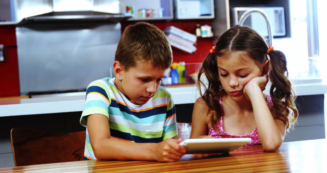 Kids Using Tablet in Modern Kitchen - Free Images, Stock Photos and Pictures on Pikwizard.com