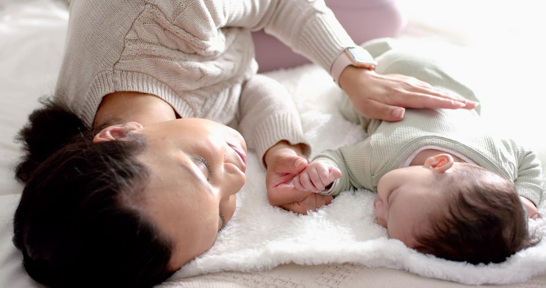 Loving Mother and Baby Lying Together in Gentle Light