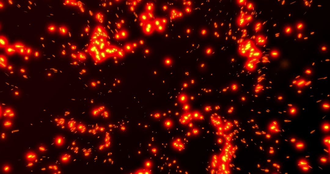 Vibrant Glowing Red Particles Exploding in Darkness