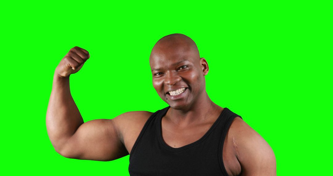 Smiling Man Flexing Arm Muscles in Black Tank Top with Green Screen Backdrop - Free Images, Stock Photos and Pictures on Pikwizard.com