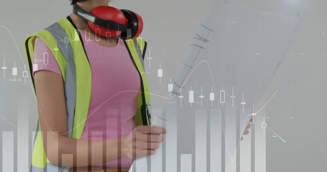 Asian Female Foreman Analyzing Construction Plans with Digital Graphs