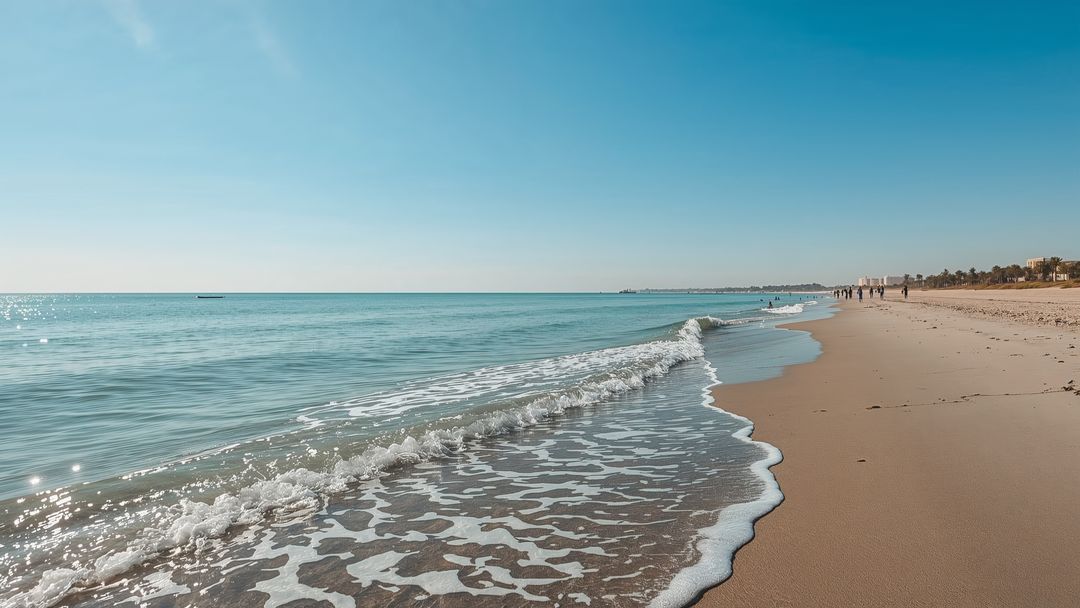 Tranquil Beach Scenery with Gentle Waves and Palm Trees