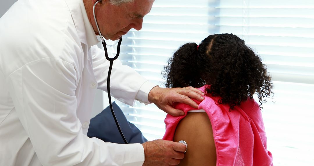 Doctor Examining Girl with Stethoscope in Clinic - Free Images, Stock Photos and Pictures on Pikwizard.com