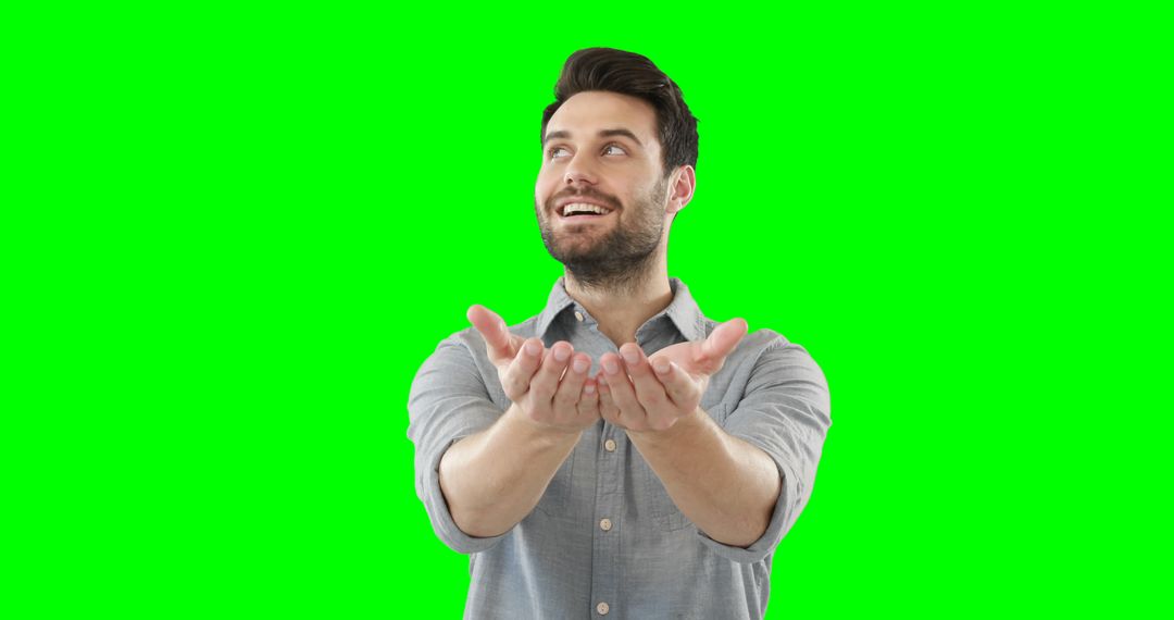 Cheerful Bearded Man Holding Hands Up on Green Screen Background - Free Images, Stock Photos and Pictures on Pikwizard.com