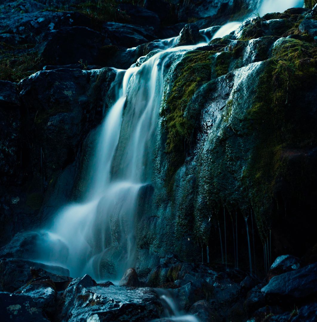 Majestic Cascading Waterfall in Lush Greenery at Twilight - Free Images, Stock Photos and Pictures on Pikwizard.com