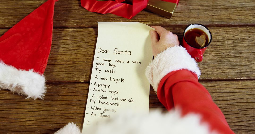 Child's Christmas Wish List with Santa Writing in Festive Setting - Free Images, Stock Photos and Pictures on Pikwizard.com