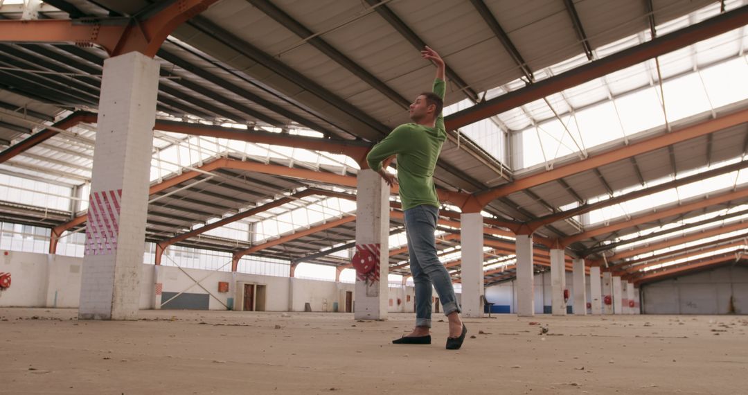 Male dancer performing in abandoned warehouse, mixed media art - Free Images, Stock Photos and Pictures on Pikwizard.com