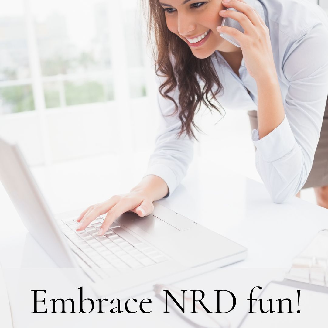 Cheerful Businesswoman Multitasking with Phone and Laptop at Office Desk
