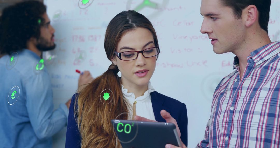 Business Team Discussing Eco-Friendly Strategies with Tech