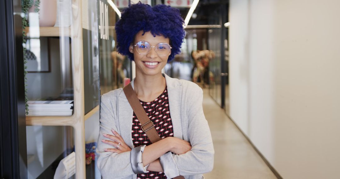 Confident Young Woman with Blue Hair and Glasses in Modern Office Setting - Free Images, Stock Photos and Pictures on Pikwizard.com