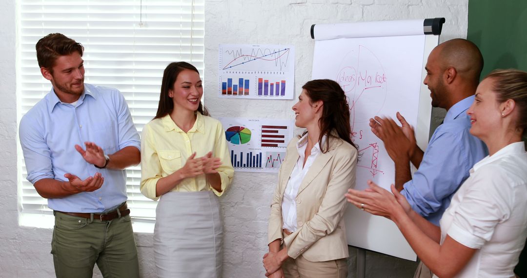 Team Applauding Achievements in Office Presentation - Free Images, Stock Photos and Pictures on Pikwizard.com