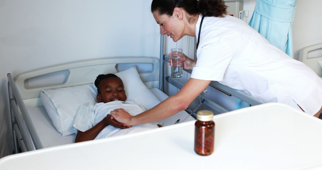 Nurse Comforting Young Patient in Hospital Bed with Medicine - Free Images, Stock Photos and Pictures on Pikwizard.com