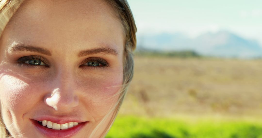 Close-Up of Smiling Young Blonde Woman Outdoors - Free Images, Stock Photos and Pictures on Pikwizard.com