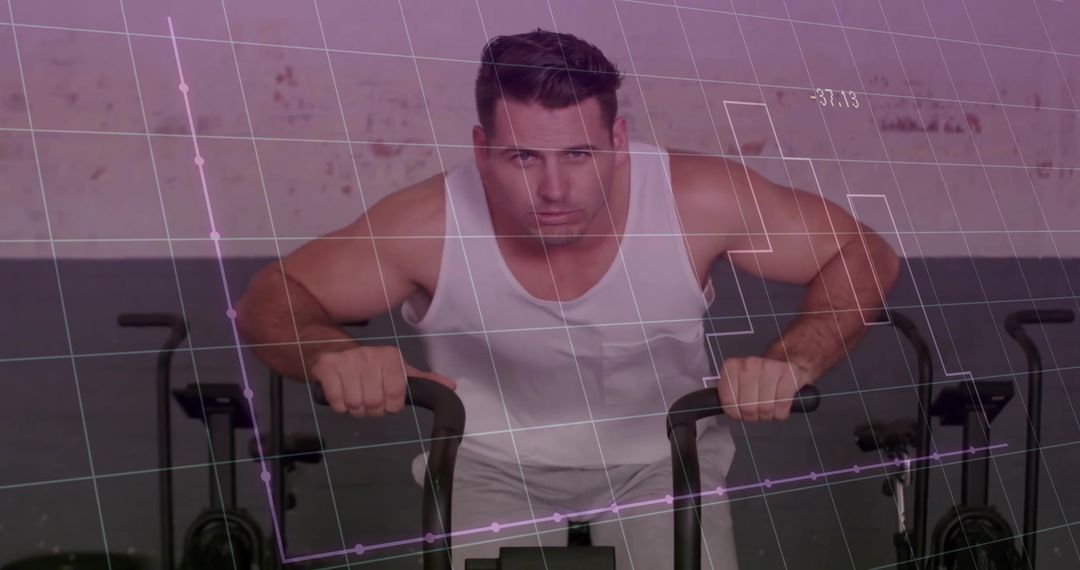 Focused Man Using Air Bike with Fitness Technology Data Overlay
