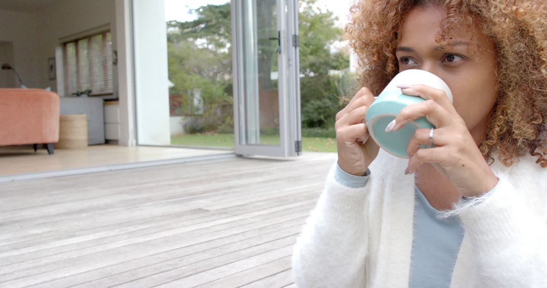 Relaxed Woman Drinking Coffee in Modern Home - Free Images, Stock Photos and Pictures on Pikwizard.com