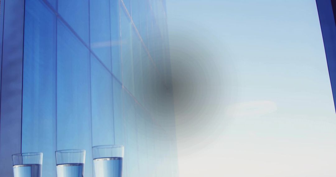 Minimalist Glasses on Reflective Ledge with Urban Background