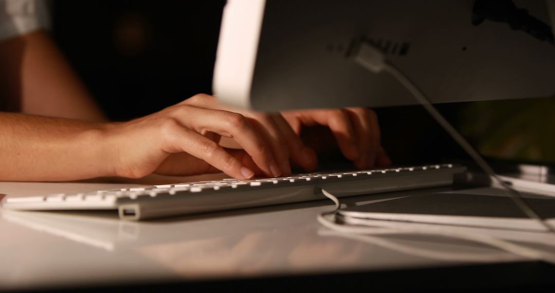 Hands Typing on Keyboard in Low Light - Free Images, Stock Photos and Pictures on Pikwizard.com