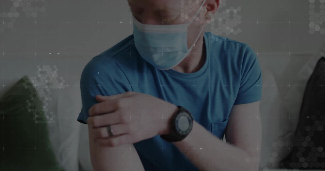 Masked Man Examining Arm While Relaxing at Home with Futuristic Overlay