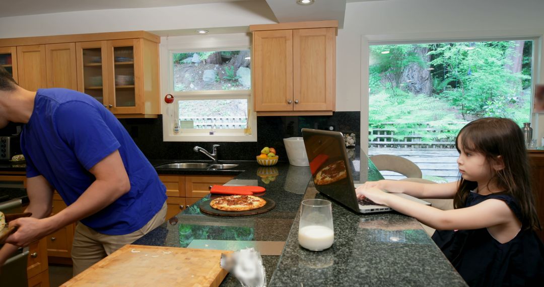 Father and Daughter Preparing Lunch Together in Modern Kitchen - Free Images, Stock Photos and Pictures on Pikwizard.com