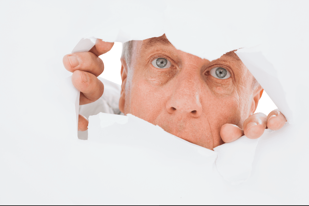 Senior Man Peers Through Ripped Paper with Curious Gaze
