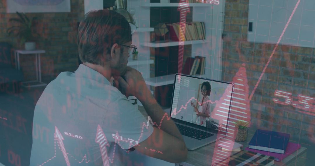 Focused Man Analyzing Financial Growth Chart on Laptop