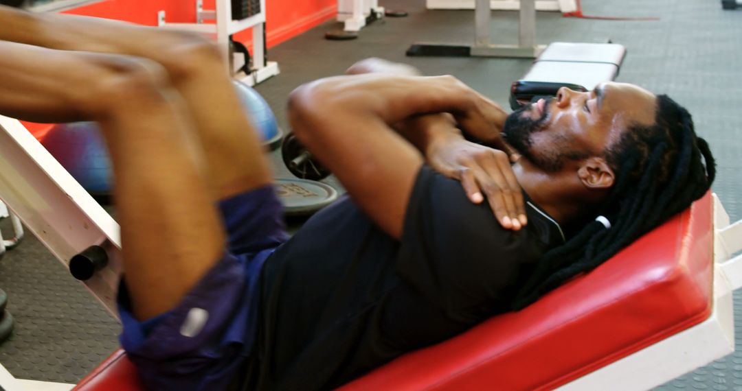 Man with Dreadlocks Using Leg Press Machine for Workout - Free Images, Stock Photos and Pictures on Pikwizard.com