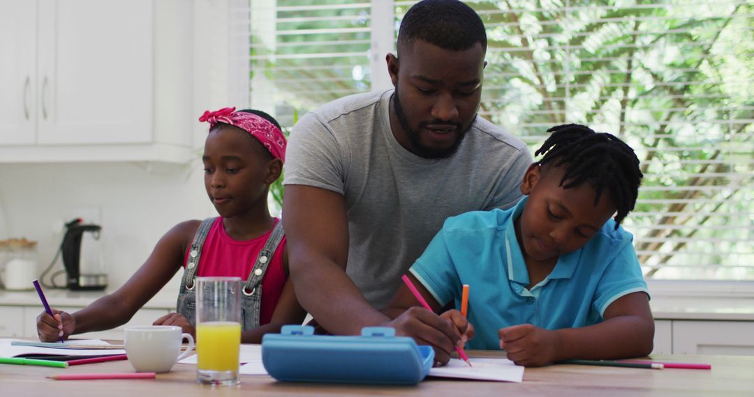 Father Helping Children with Homework in Kitchen - Free Images, Stock Photos and Pictures on Pikwizard.com