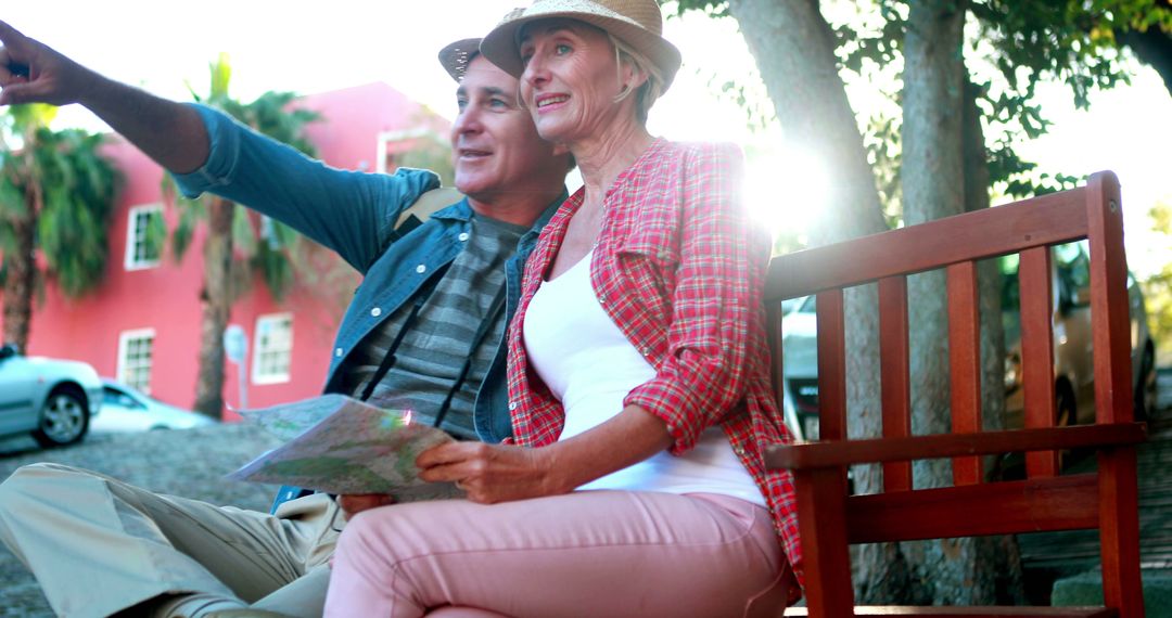 Senior Couple Exploring New City with Map in Bright Sunlight