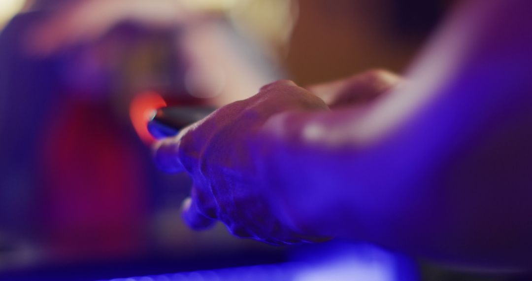 Close-Up of Hands Using Smartphone in Neon Lighting - Free Images, Stock Photos and Pictures on Pikwizard.com