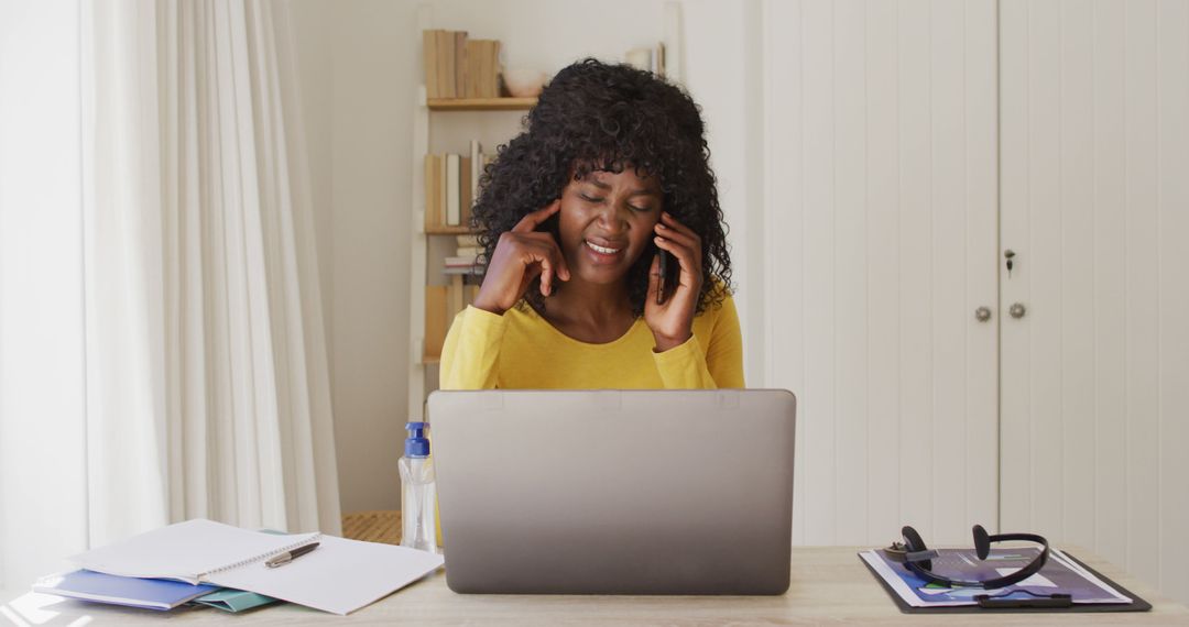 Woman experiencing stress while working from home on laptop - Free Images, Stock Photos and Pictures on Pikwizard.com