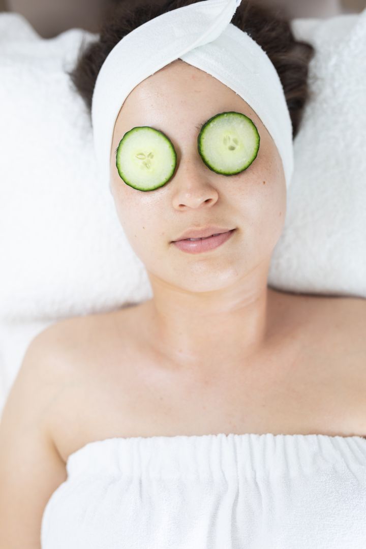 Woman Relaxing with Cucumber Slices on Eyes at Beauty Salon - Free Images, Stock Photos and Pictures on Pikwizard.com